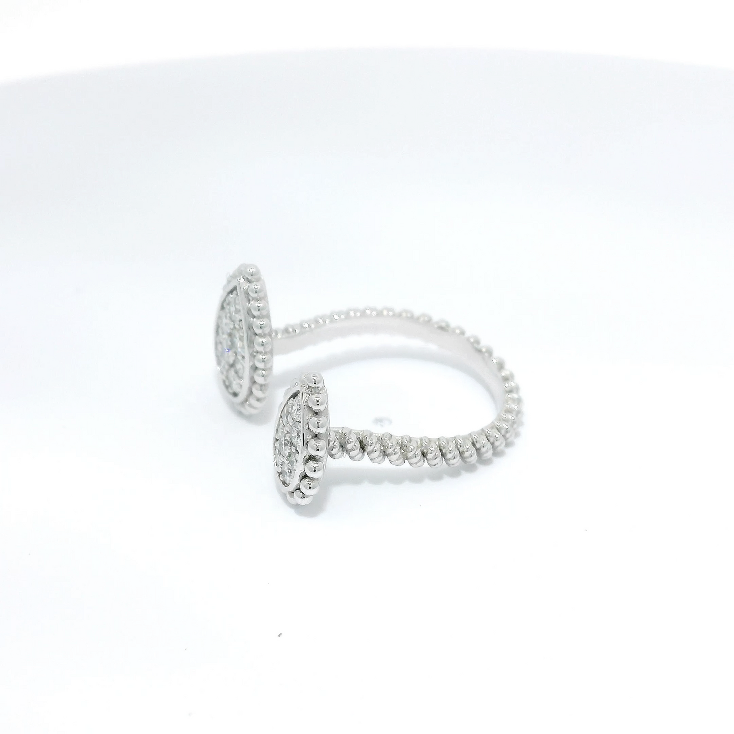 Diamond Encased in Beaded Halo Between-Finger Ring in 18K White Gold